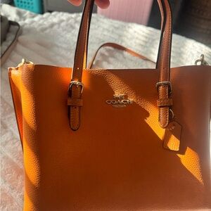 Coach Orange Leather Purse with Structured Design